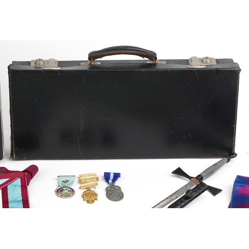 2427 - Collection of masonic memorabilia to include a Widmord Lodge silver enamelled badge and two aprons, ... 