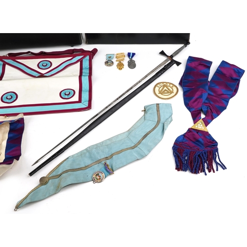 2427 - Collection of masonic memorabilia to include a Widmord Lodge silver enamelled badge and two aprons, ... 