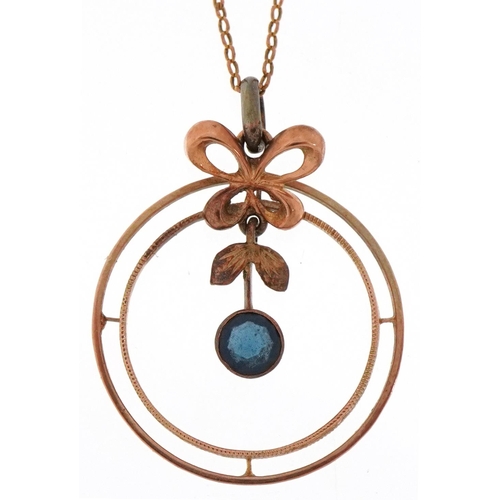 3199 - 9ct gold and sapphire necklace, the central drop sapphire within a butterfly and circular mount, 1.8... 