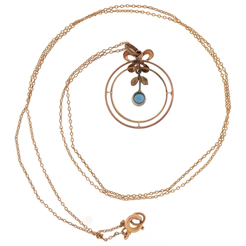 3199 - 9ct gold and sapphire necklace, the central drop sapphire within a butterfly and circular mount, 1.8... 