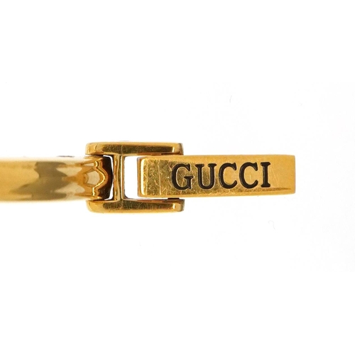 3107 - Gucci gold plated ladies bracelet wristwatch with interchangeable coloured bezels, the case 2.8cm in... 