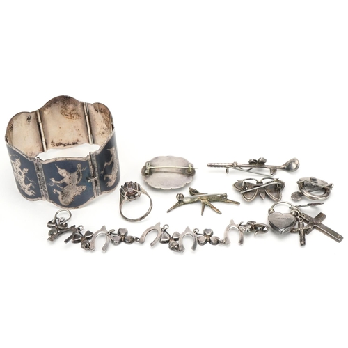 3344 - Small group of silver jewellery including an Indian bangle, five brooches, charm bracelet and a past... 