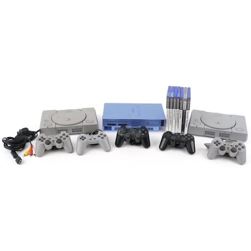 2068 - Two Sony PlayStation 1 games consoles with controllers, a Sony PlayStation 2 and a collection of Pla... 