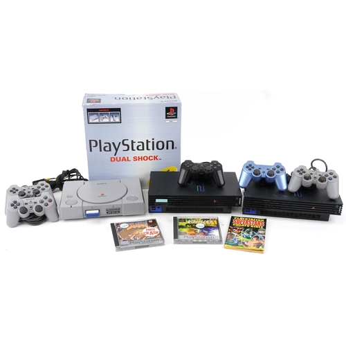 2072 - Sony PlayStation 1 and Sony PlayStation 2 games consoles with controllers