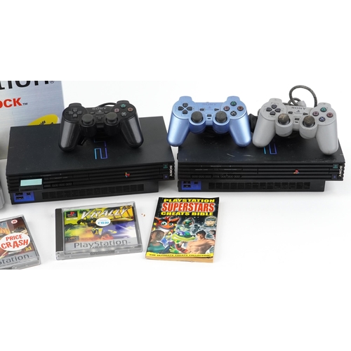 2072 - Sony PlayStation 1 and Sony PlayStation 2 games consoles with controllers