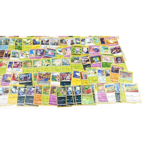 2027 - Pokémon collectables including a large collection of trade cards, some holographic, PokéBalls and co... 