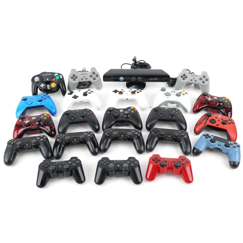 2071 - Collection of PlayStation and Xbox controllers and an Xbox 360 Kinect