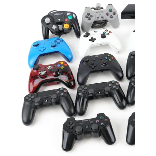 2071 - Collection of PlayStation and Xbox controllers and an Xbox 360 Kinect