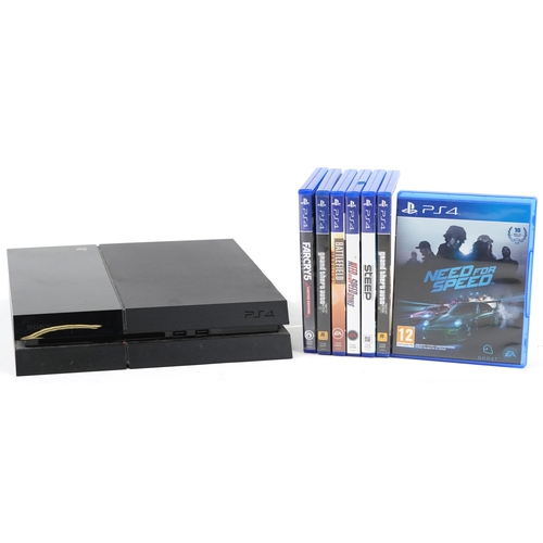 2064 - Sony PlayStation 4 games console with a collection of games including Grand Theft Auto 5, Need for S... 