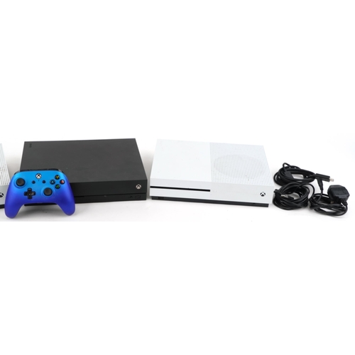 2067 - Two Xbox One S games consoles and an Xbox One X games console