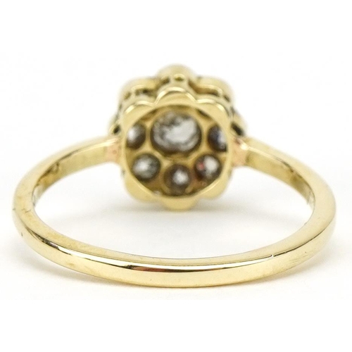 3077 - Unmarked gold diamond flower head ring, the central diamond approximately 0.16 carat, size K, 2.5g