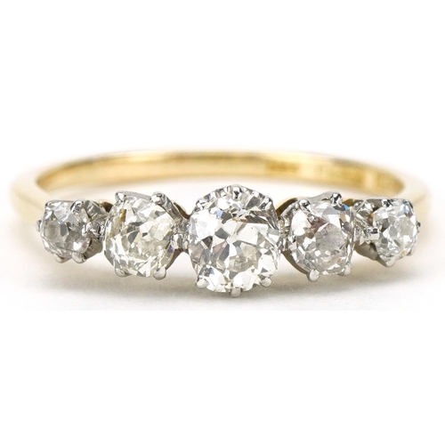 3014 - 18ct gold graduated diamond five stone ring, the central diamond approximately 4.50mm x 4.50mm x 3.2... 