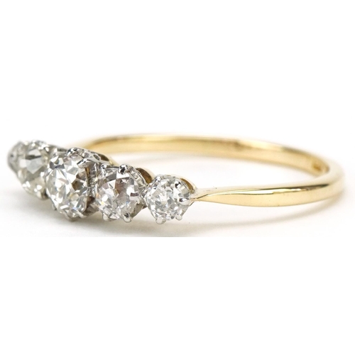 3014 - 18ct gold graduated diamond five stone ring, the central diamond approximately 4.50mm x 4.50mm x 3.2... 