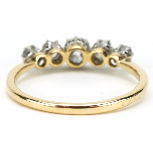 3014 - 18ct gold graduated diamond five stone ring, the central diamond approximately 4.50mm x 4.50mm x 3.2... 