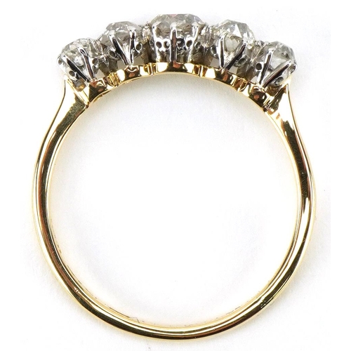 3014 - 18ct gold graduated diamond five stone ring, the central diamond approximately 4.50mm x 4.50mm x 3.2... 