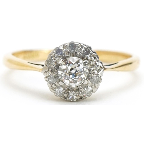 3056 - 18ct gold and platinum diamond cluster ring, the central diamond approximately 0.18 carat, size O, 2... 