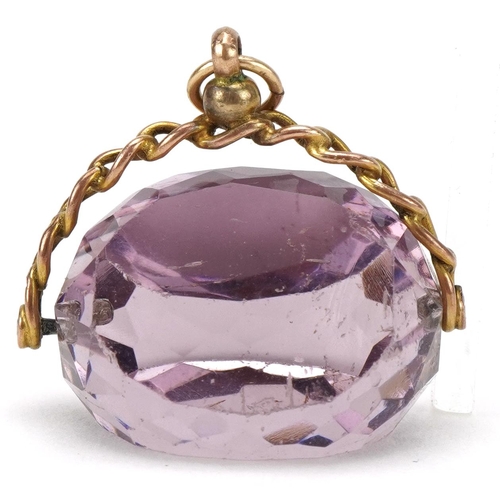 3073 - Large 9ct rose gold facet cut amethyst spinner fob, 2.8cm wide, 12.0g