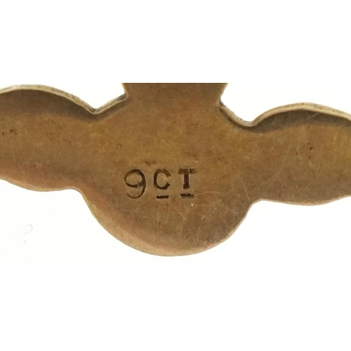 3200 - Three 9ct gold charms comprising pig, RAF wings and a drum, the largest 2cm wide, total 1.9g