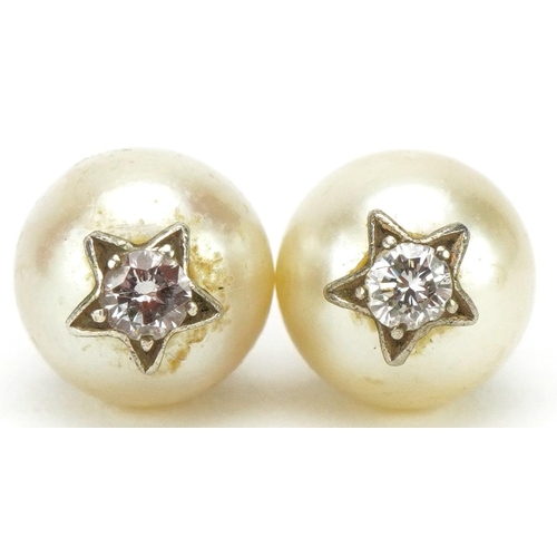 3026 - Pair of unmarked cultured pearl and diamond solitaire earrings with screw studs, each pearl approxim... 