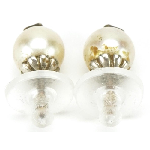 3026 - Pair of unmarked cultured pearl and diamond solitaire earrings with screw studs, each pearl approxim... 