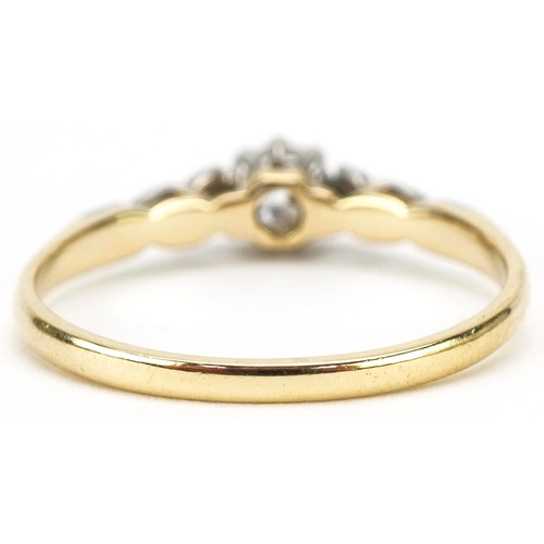 3060 - 18ct gold and platinum diamond solitaire ring, the diamond approximately 0.18 carat, size M, 1.8g