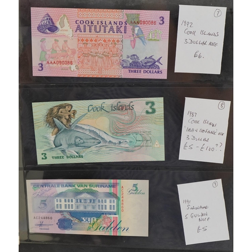 2253 - Green album containing vintage banknotes to include a Singapore 1979 twenty dollars, Cook Islands th... 