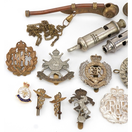 2528 - Military interest cap badges and whistles including a silver and enamel RAF sweetheart brooch and na... 