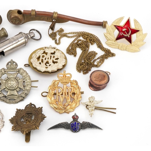 2528 - Military interest cap badges and whistles including a silver and enamel RAF sweetheart brooch and na... 