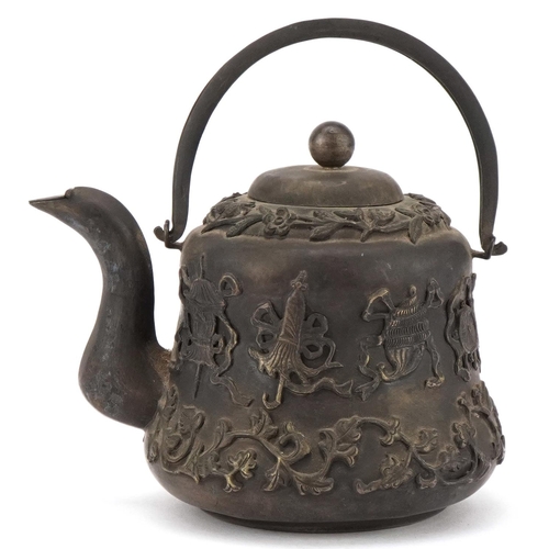 1148 - Chinese white metal teapot decorated in relief with foliage and objects, with box, 9.5cm high