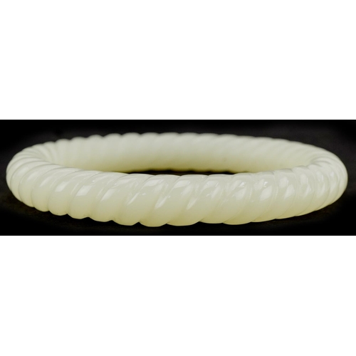 3136 - Chinese jade rope twist design bangle, 8cm in diameter, 42.5g