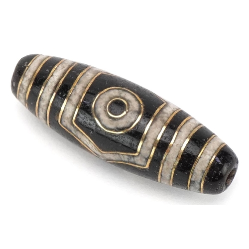 1397 - Islamic agate bead with yellow metal inlay, 3.5cm in length