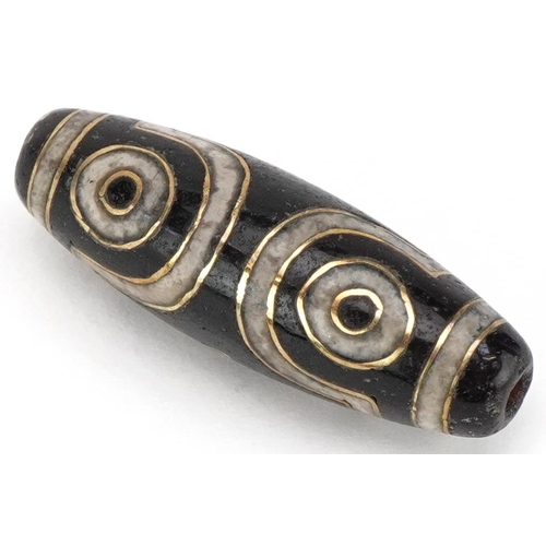 1397 - Islamic agate bead with yellow metal inlay, 3.5cm in length