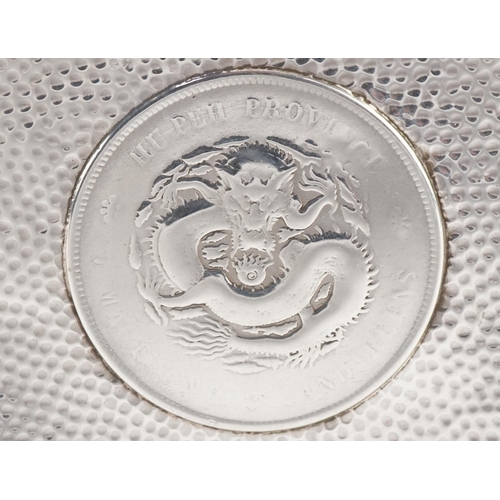 150 - Circular Chinese silver coin design dish, 9.5cm in diameter, 51.2g