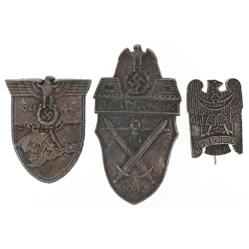 2609 - Three German military World War II badges, the largest 9cm high