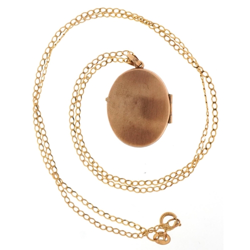 3086 - 9ct two tone gold locket on a 9ct gold necklace, 2.5cm high and 46cm in length, total 2.8g