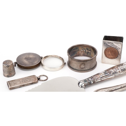 485 - Silver objects including a folding magnifying glass, matchbox case, whistle and silver handled cutle... 