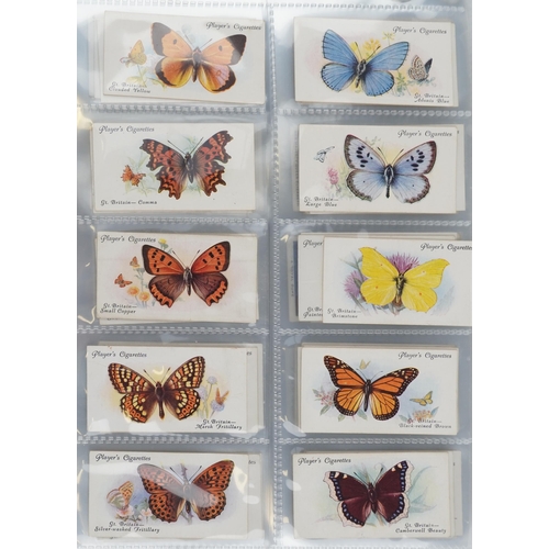 2296 - Nine albums of cigarette cards to include Player's Natural History set of fifty, Ogden's Zoo Studies... 