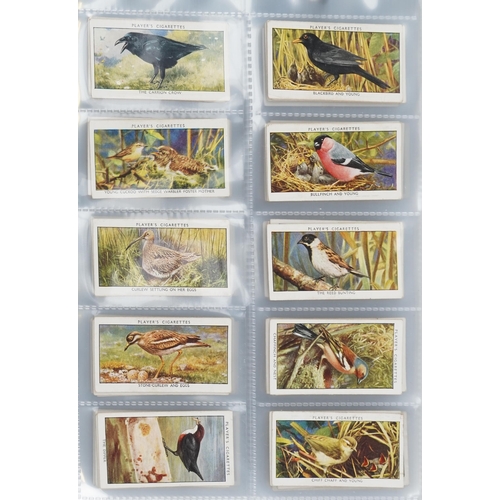 2296 - Nine albums of cigarette cards to include Player's Natural History set of fifty, Ogden's Zoo Studies... 