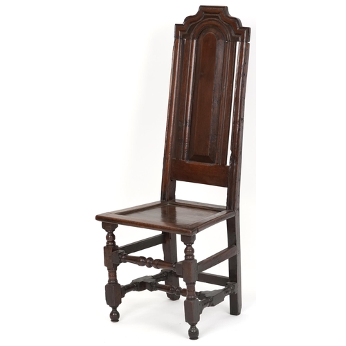 1070 - 18th century oak panel back hall chair with solid seat raised on turned and block legs united by str... 