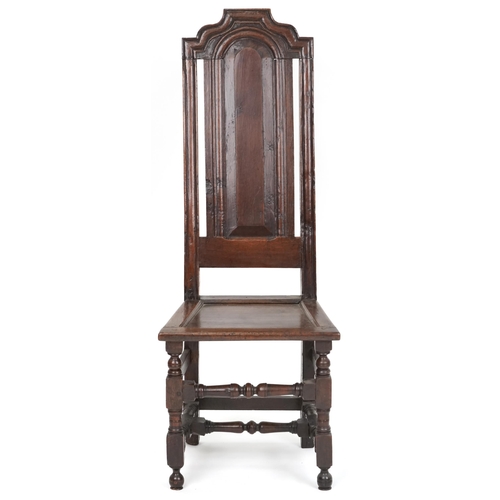 1070 - 18th century oak panel back hall chair with solid seat raised on turned and block legs united by str... 