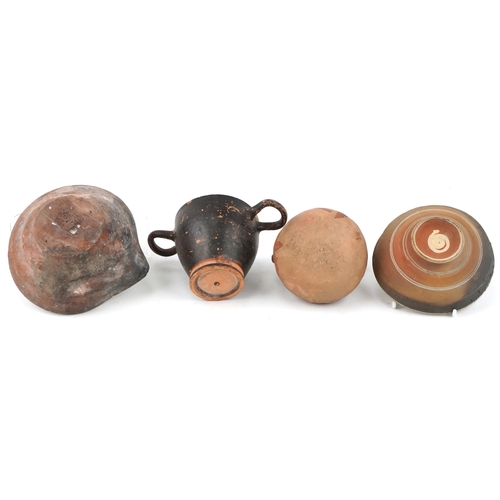 355 - Group of four Greek pottery items including footed bowl, jug, two handled cup and a pouring vessel, ... 