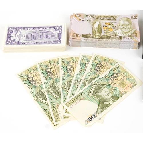 2244 - Quantity of world banknotes in mint condition, many in bundles and a set of six gold plated ingots i... 