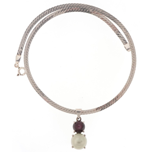 3163 - Unmarked silver cabochon moonstone and star ruby pendant on a silver necklace, 3.2cm high and 40cm i... 