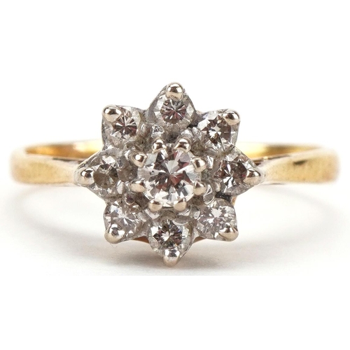 3074 - 18ct gold diamond flower head ring, the central diamond approximately 0.17 carat, size Q, 3.6g