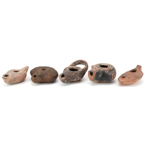 356 - Group of five ancient Roman and Egyptian oil lamp burners including an Egyptian frog lamp, two Byzan... 