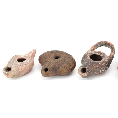 356 - Group of five ancient Roman and Egyptian oil lamp burners including an Egyptian frog lamp, two Byzan... 