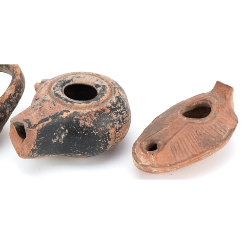 356 - Group of five ancient Roman and Egyptian oil lamp burners including an Egyptian frog lamp, two Byzan... 