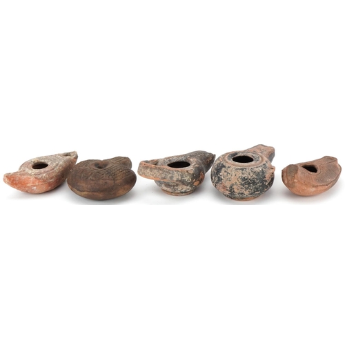 356 - Group of five ancient Roman and Egyptian oil lamp burners including an Egyptian frog lamp, two Byzan... 