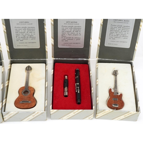 415 - Six miniature Italian sterling silver musical instruments by Sacchetti, the largest 10cm in length