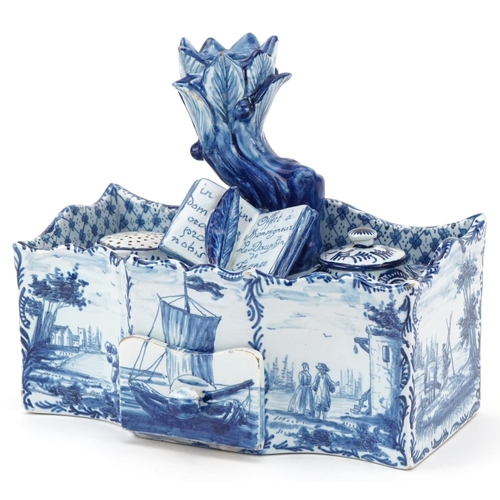 304 - Dutch Delft blue and white faience double inkwell, 19th century, the naturalistic top fitted with a ... 